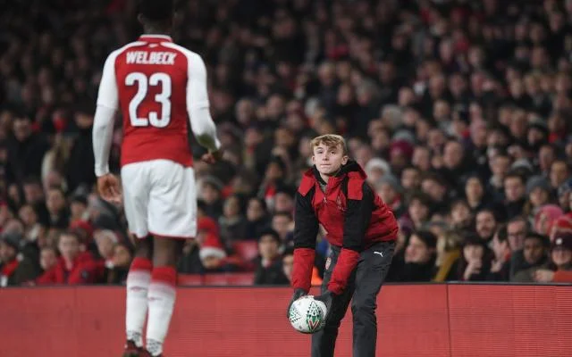 Premier League ball boy giving back the ball to a player