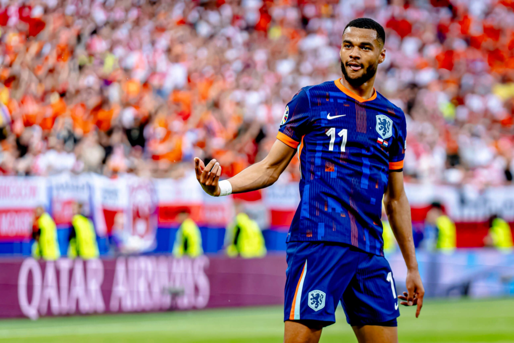 Gakpo reacts after scoring against Poland.