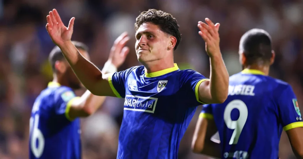 AFC Wimbledon players celebrate a goal