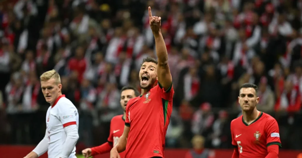 Ruben Dias of Portugal gestures towards the referee