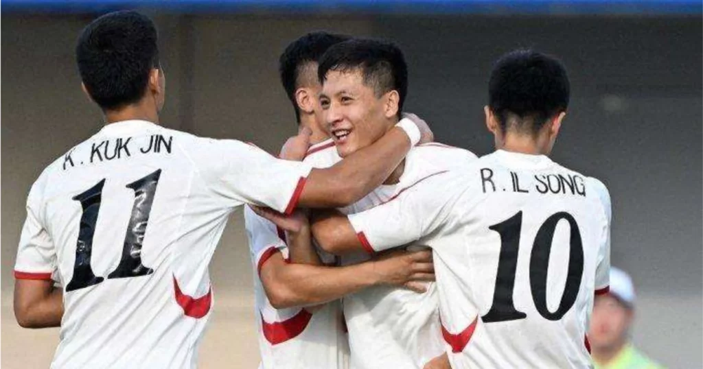 Il Song (R) celebrating with his teammates