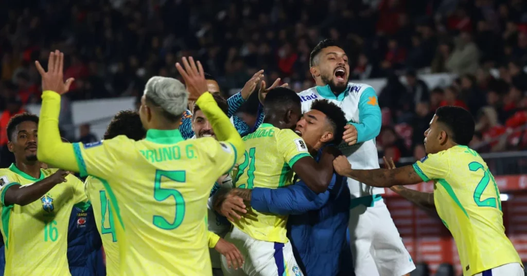 Brazil players celebrating their winner against Chile