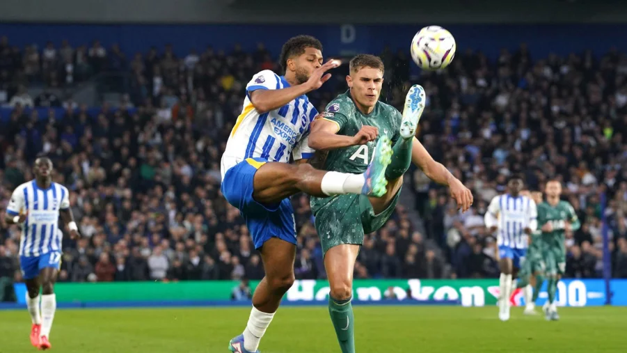 Tottenham Hotspur's Micky van de Ven and Brighton & Hove Albion's Georginio Rutter 