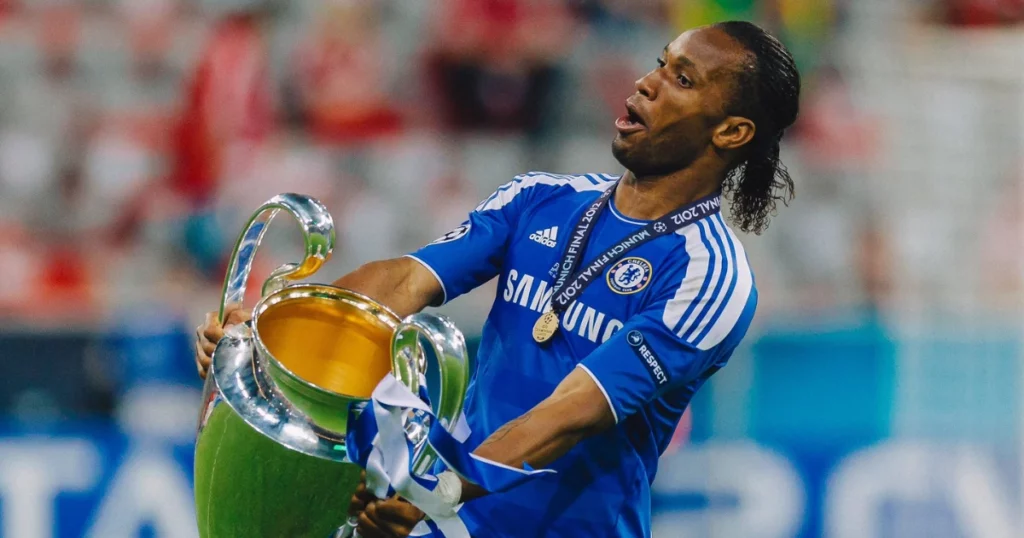Didier Drogba celebrating with the UEFA Champions League trophy