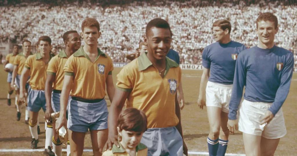 Pele leads the Brazil National team during a game against Italy