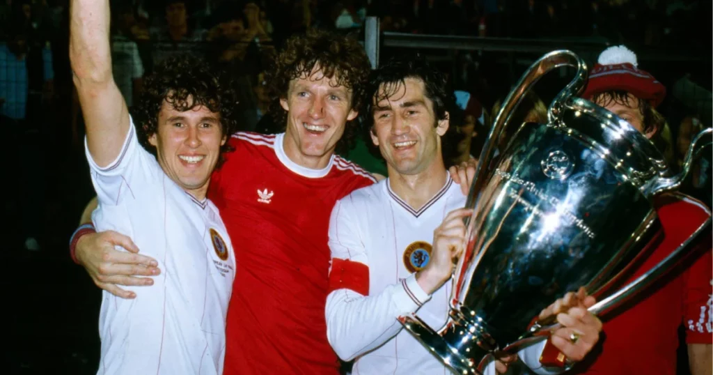 Aston Villa players with UEFA Champions League trophy