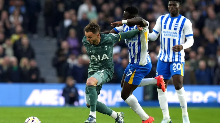 Tottenham Hotspur's James Maddison (left) and Brighton and Hove Albion's Yankuba Minteh