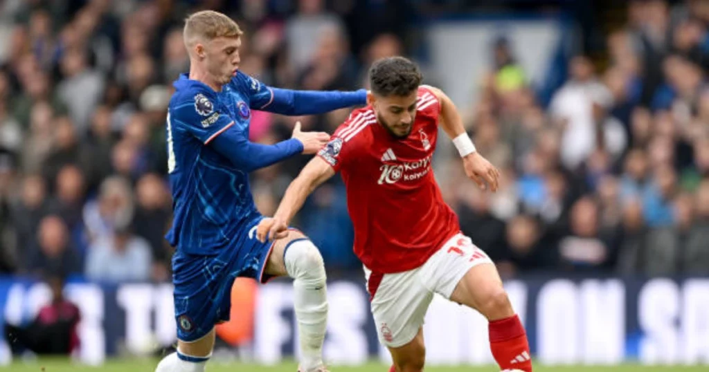 Cole Palmer against one of the Nottingham Forest player