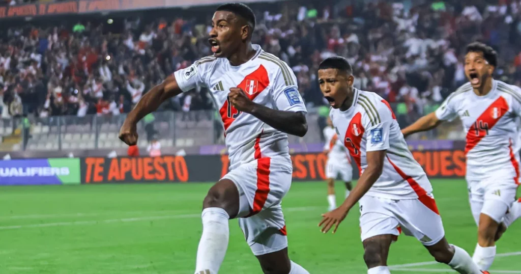 Peru players celebrating their winner against Uruguay