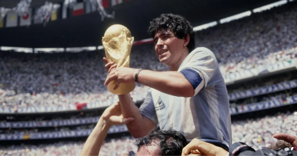 Diego Maradona holding the World Cup trophy 