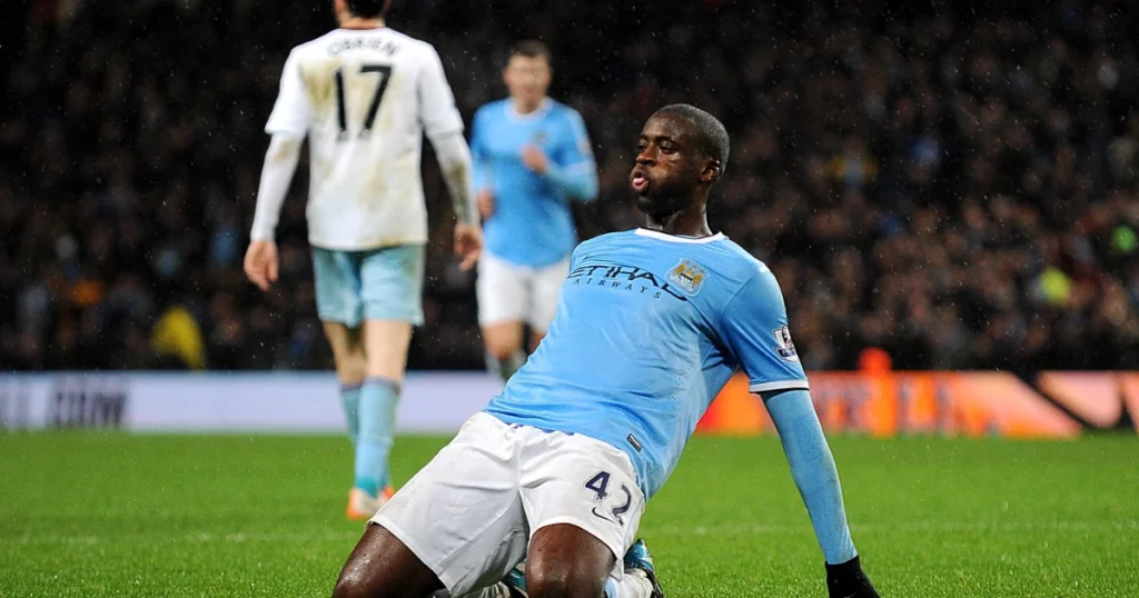 Yaya Toure celebrates his goal with his trademark kneeslide.