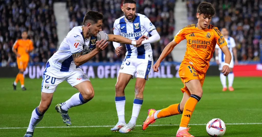 Leganes players attempt to defend Arda Guler