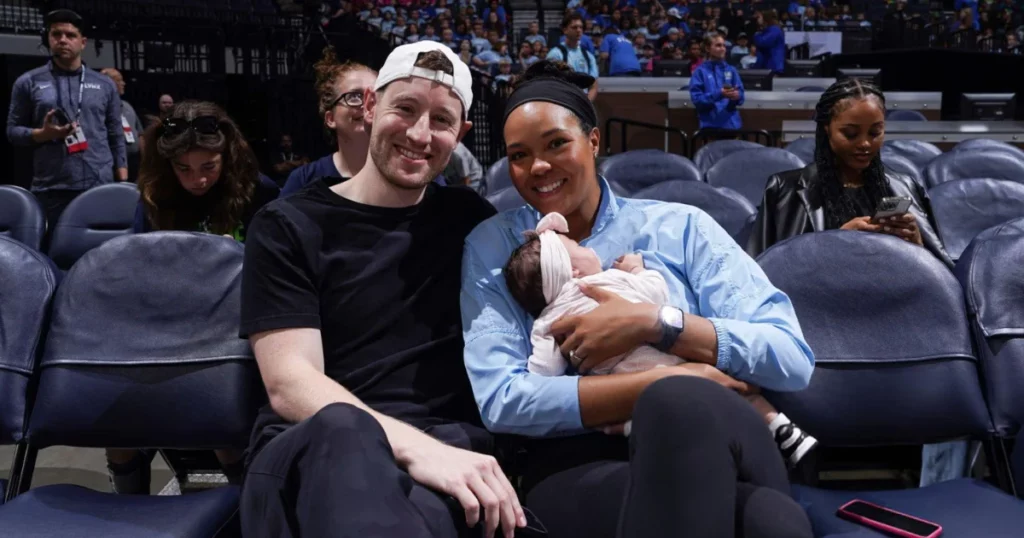 Napheesa Collier with husband and daughter