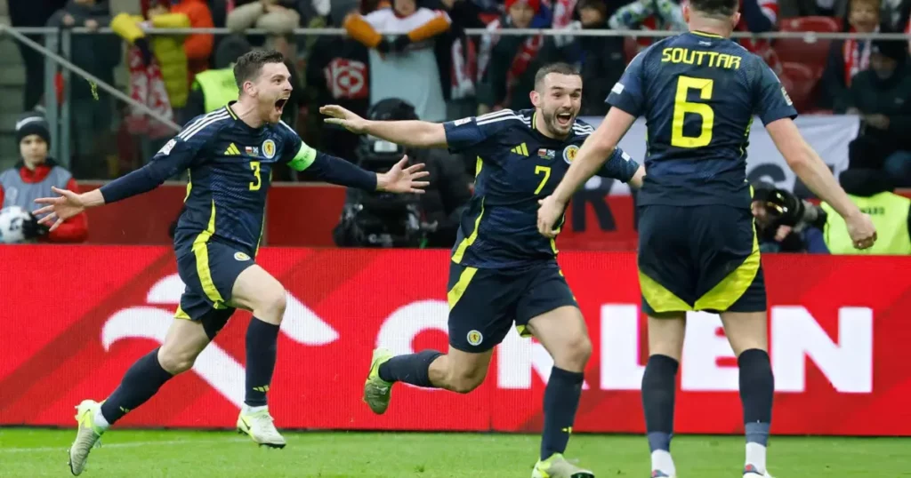 Scotland players celebrating John McGinn's goal