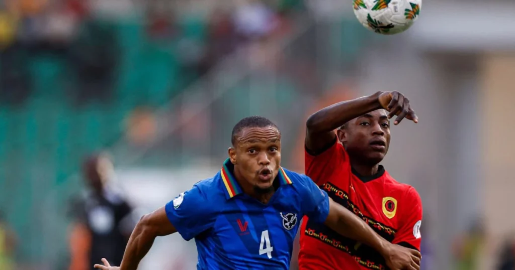 Namibia's defender #4 Riaan Hanamub (L) fights for the ball with Angola's forward #7 Gilberto