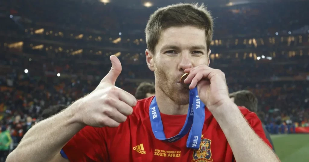 Xabi Alonso kissing 2010 FIFA World Cup gold medal