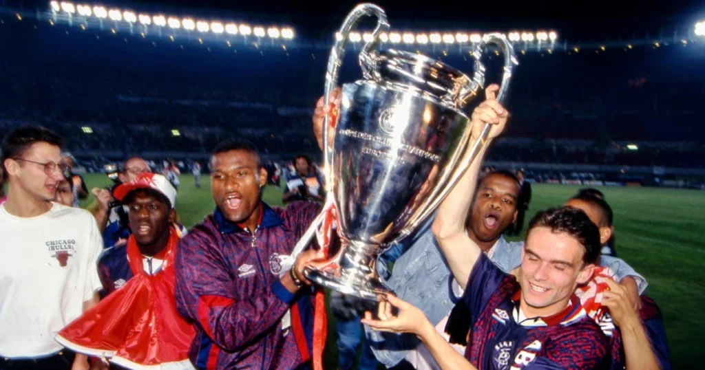 Ajax players celebrate after beating AC Milan