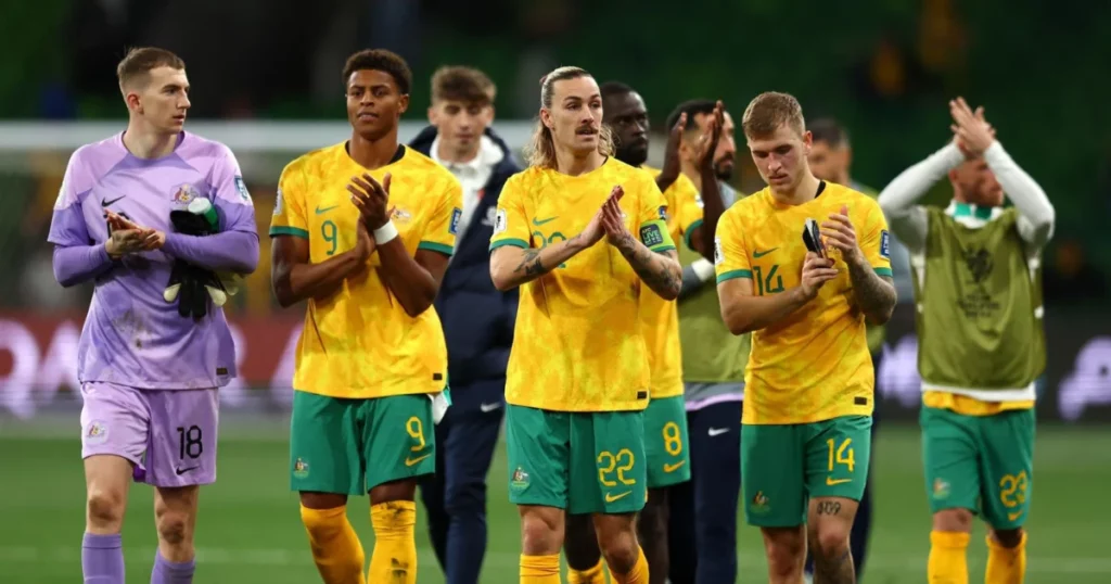 Players of the Australian Football Team clap for their supporters after their game against Saudi Arabia