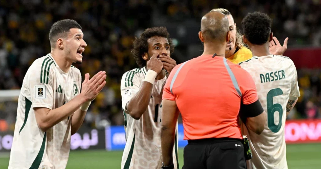 Players of Saudi Arabia contest the referee's decision to rule out their late winner