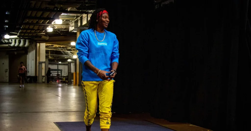 Arike Ogunbowale in a neon yellow dress at the 2024 Draft Night.