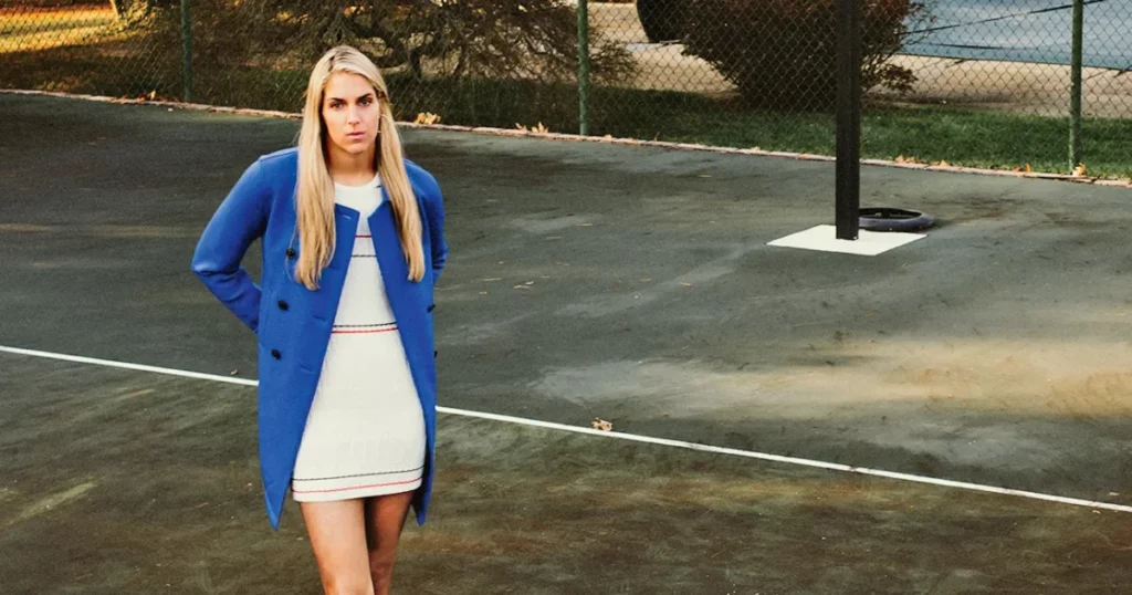 Elena Delle Donne in a tailored navy suit at a 2024 charity auction.