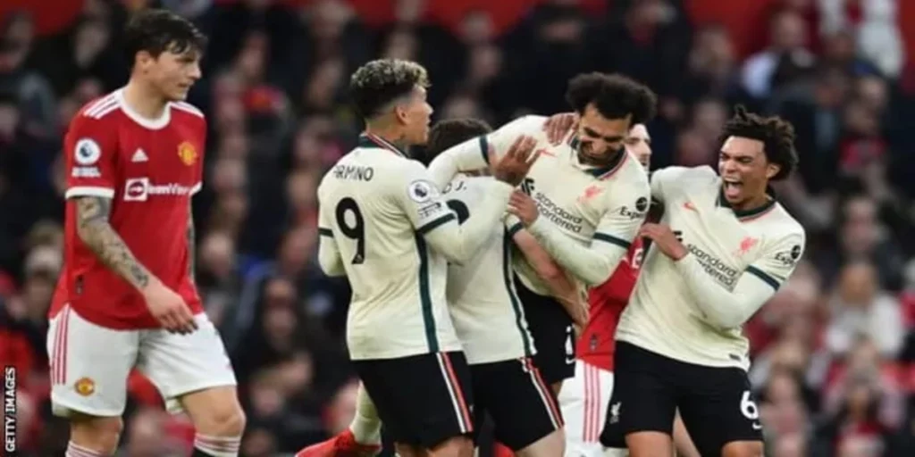 Mohamed Salah celebrates with his team-mates after scoring a hat-trick