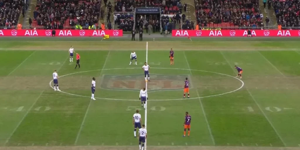 A Champions League game being played right after an NFL game was held at the Wembley Stadium with the NFL's logo and markings clearly visible 