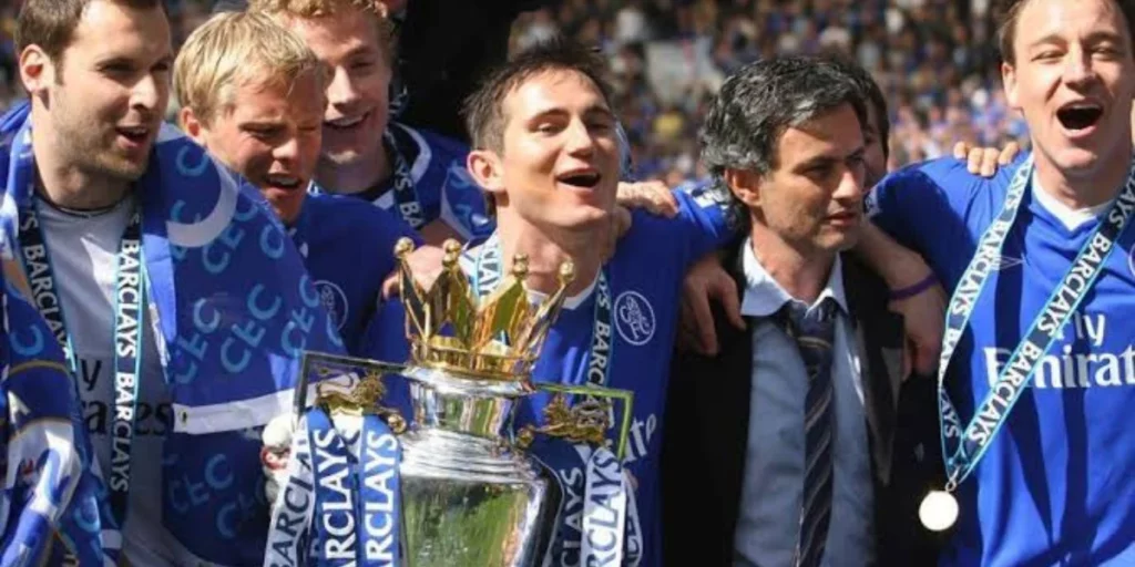 Mourinho with the Chelsea squad after their title triumph