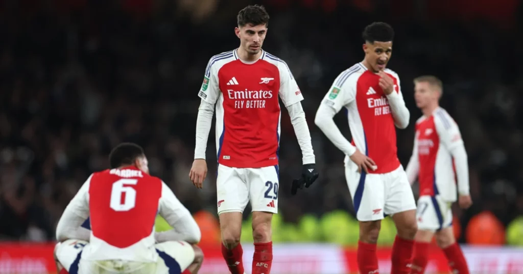 Arsenal players dejected after defeat