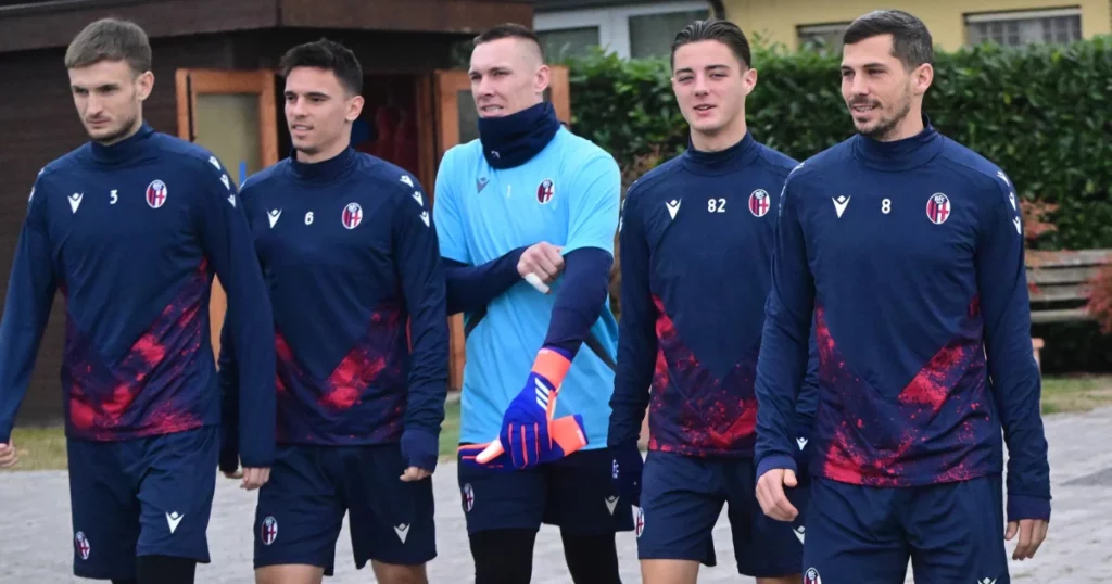 Bologna players arrive for their training session