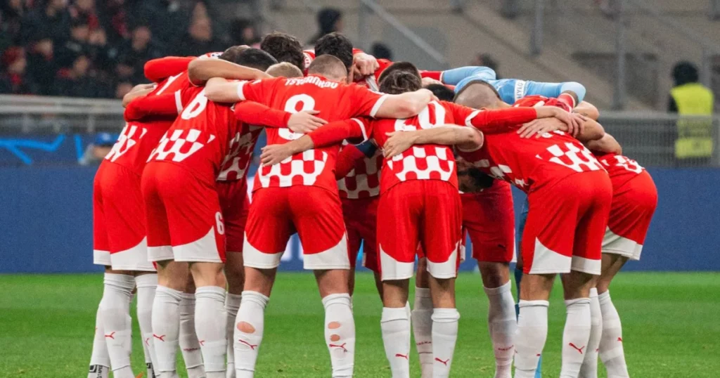 Girona players ahead of their game against AC Milan