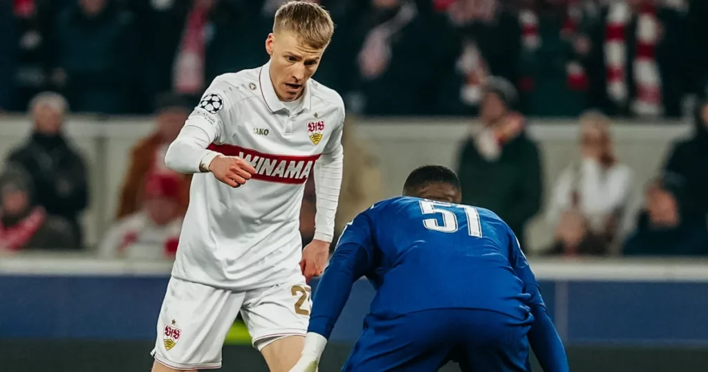 VfB Stuttgart player taking on a PSG one