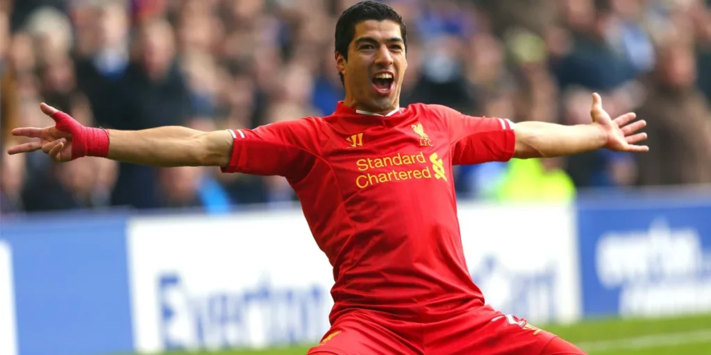 Luis Suarez celebrating after scoring for Liverpool