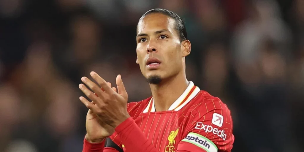 Van dijk applauding the fans after the match