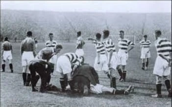 John Thomson being aided by players after a disastrous clash