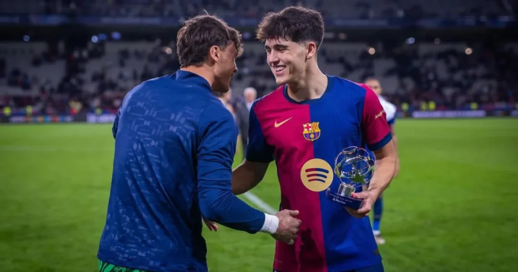 Pau Cubarsi after receiving his Man of the Match award against Napoli