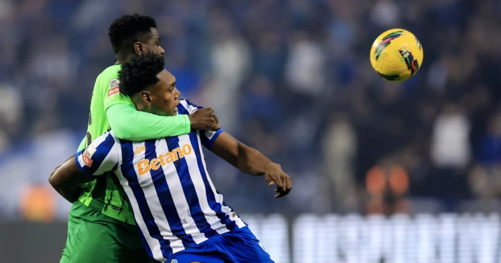 Porto's Samu shields the ball from a defender.