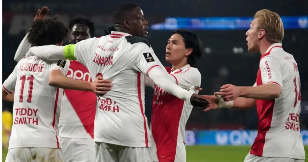 Monaco players celebrating their goal.