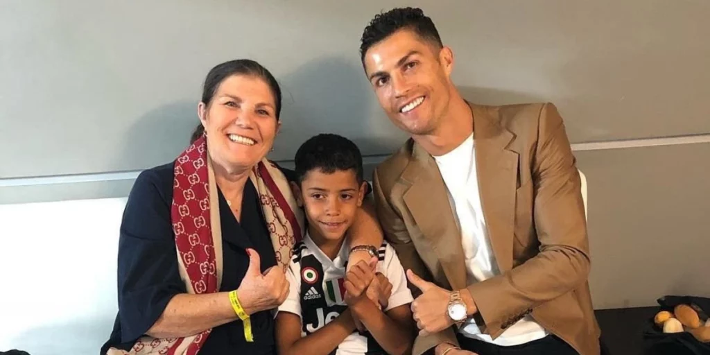 Cristiano Jr. with his grandmother and Ronaldo
