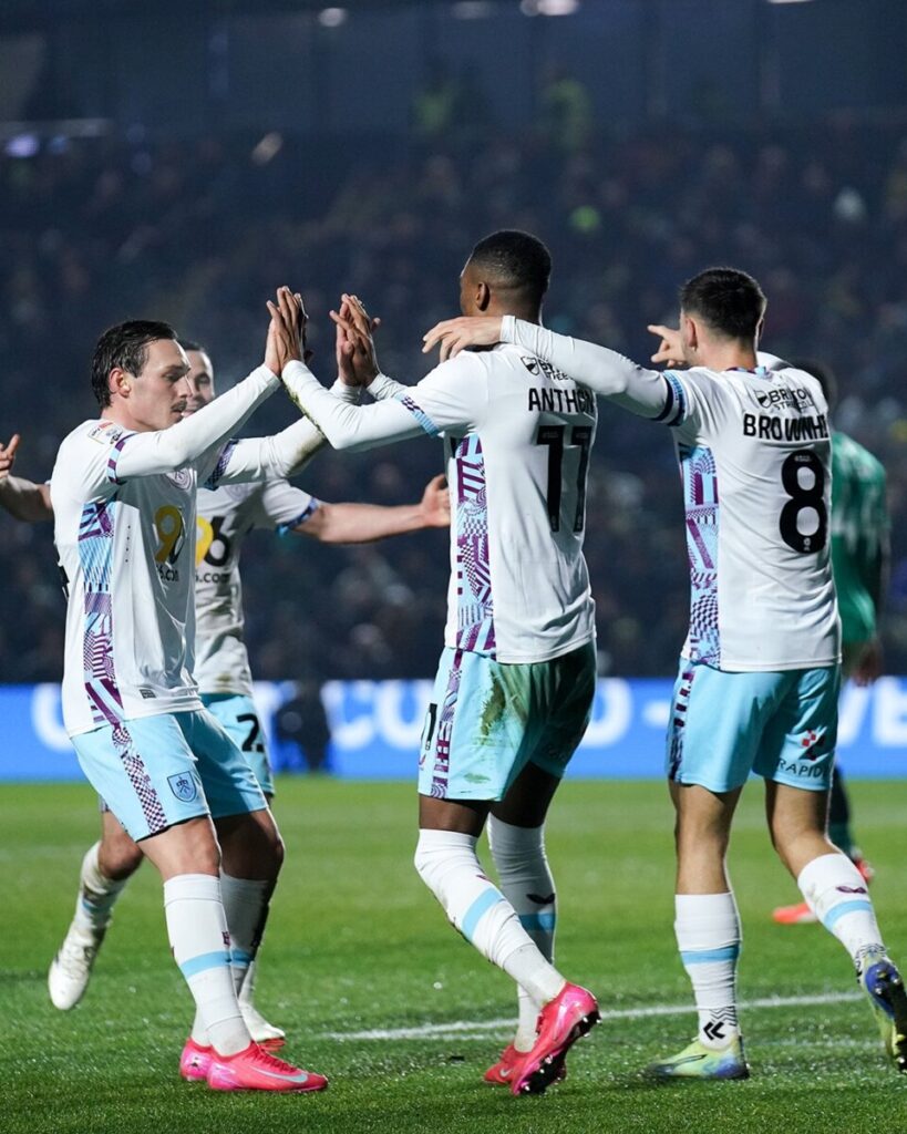 Burnley players celebrating their win against Plymouth Argyle