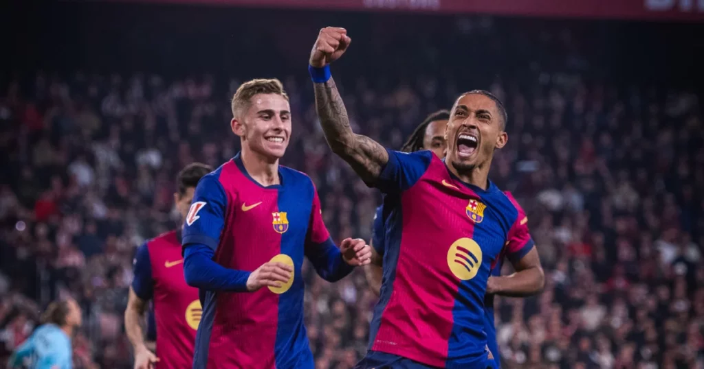 Barcelona players celebrate one of their goals against Sevilla
