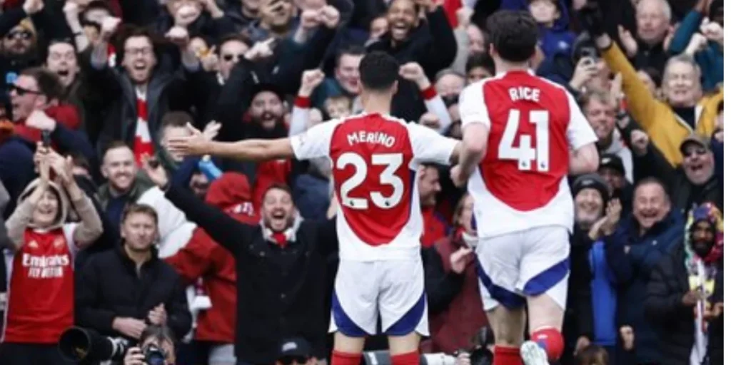 Mikel Merino celebrating with the fans after scoring the opener