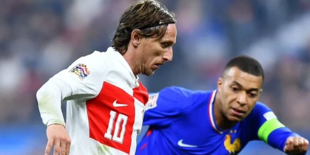 Modric and Mbappe duelling on the field