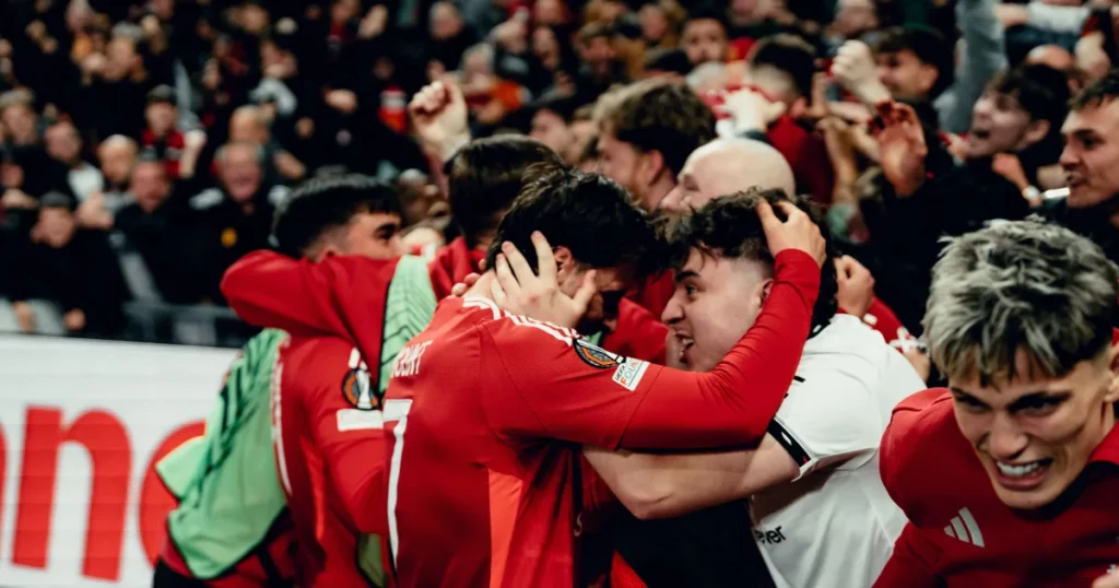 Manchester United players celebrating with fans