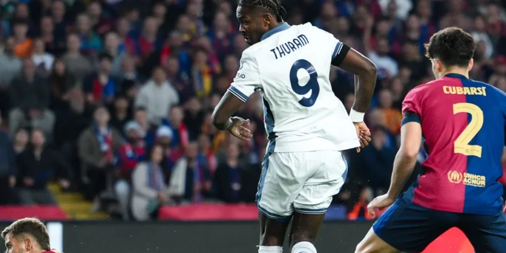 Thuram scoring an audacious flick past Barcelona's centre-backs 