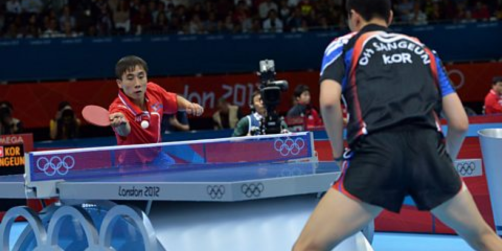 A Table Tennis clash in action