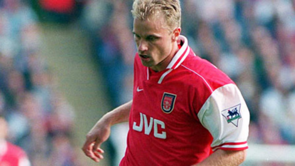 Dennis Bergkamp playing for Arsenal after having a great stint at his homeland in Amsterdam (Image Source- Official Arsenal FC website)